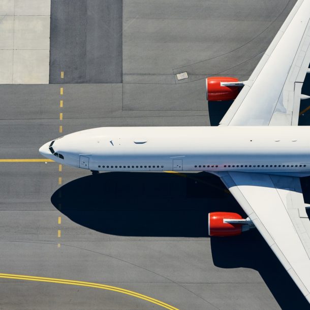 Aerial view of airport. Airplane taxiing to runway before take off.