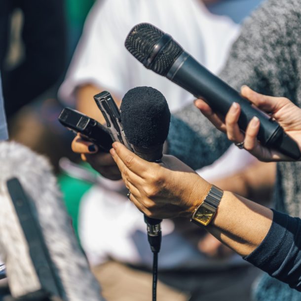 Journalists Interviewing. Female Speaker Answering Questions