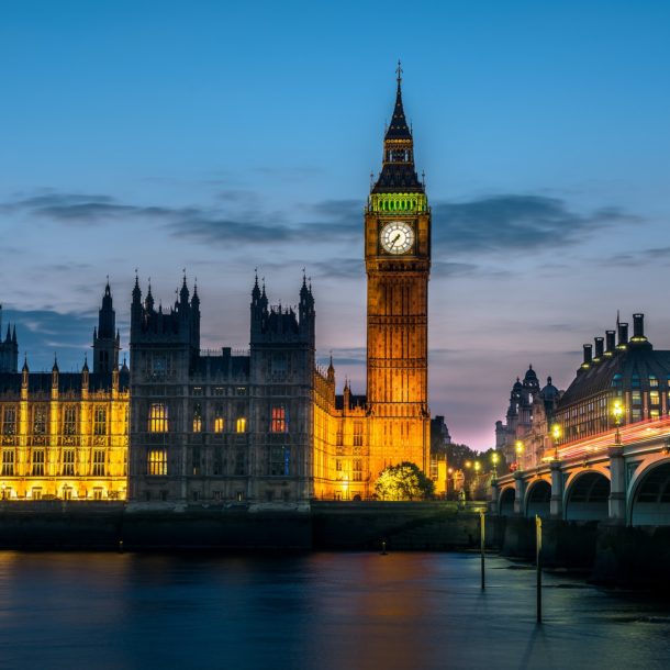 Westminster abbey and big ben in the London skyline at night, London, UK