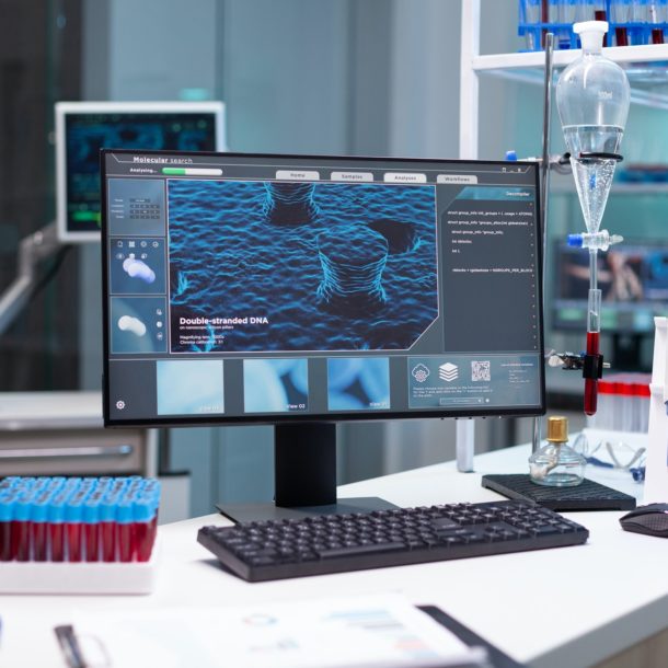 Computer with microbiology virus expertise on display standing on table