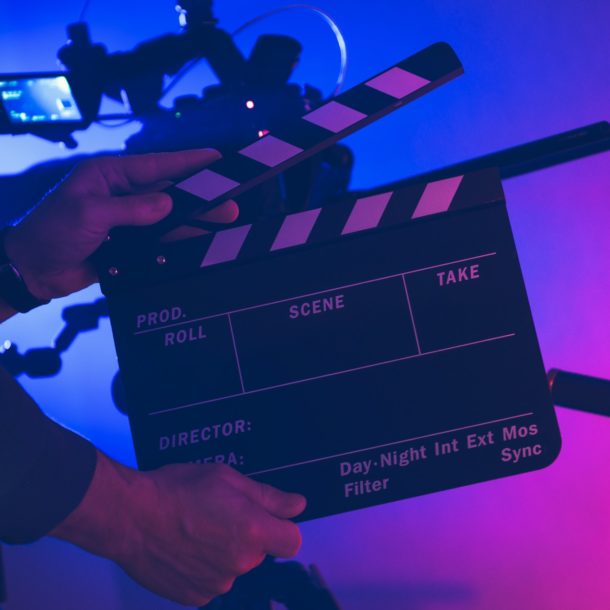 Film Making Professional with Clapperboard in His Hands