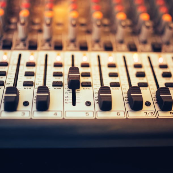 Detail of a music mixer in studio, dj working for new tracks. Music production with editing tools