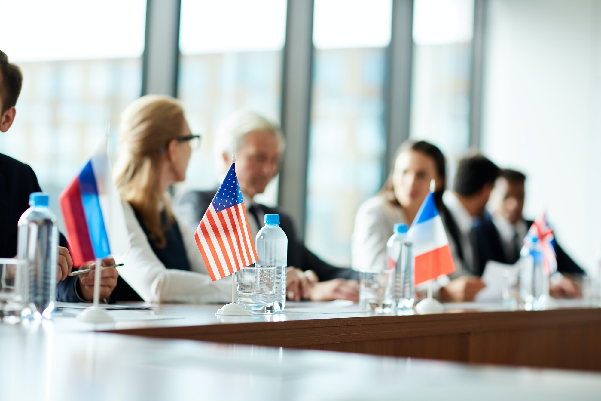 Small national flags on conference table