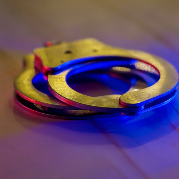 Flashing red and blue police lights of handcuffs police