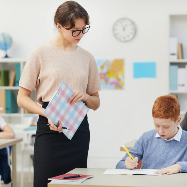 Teacher and school children at school