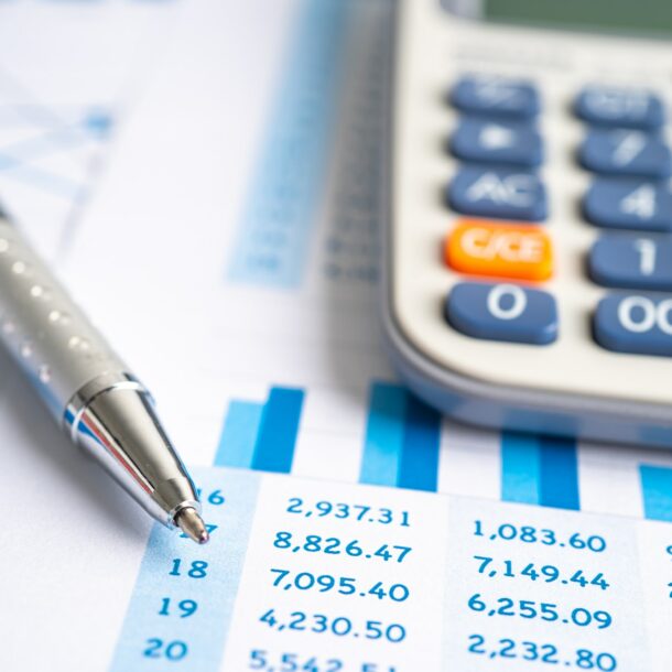 Calculator on chart graph for analysis account business trade.