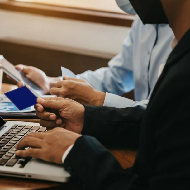 financial adviser analyzing data with investor at home office.