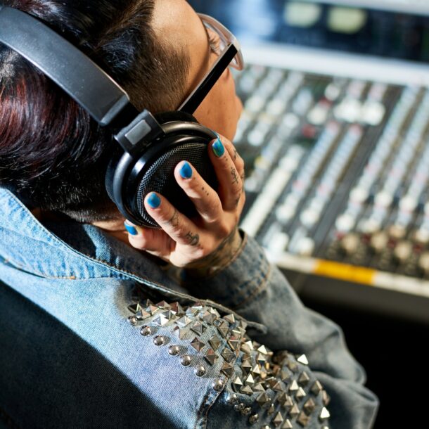 Producer listening to audio track in studio