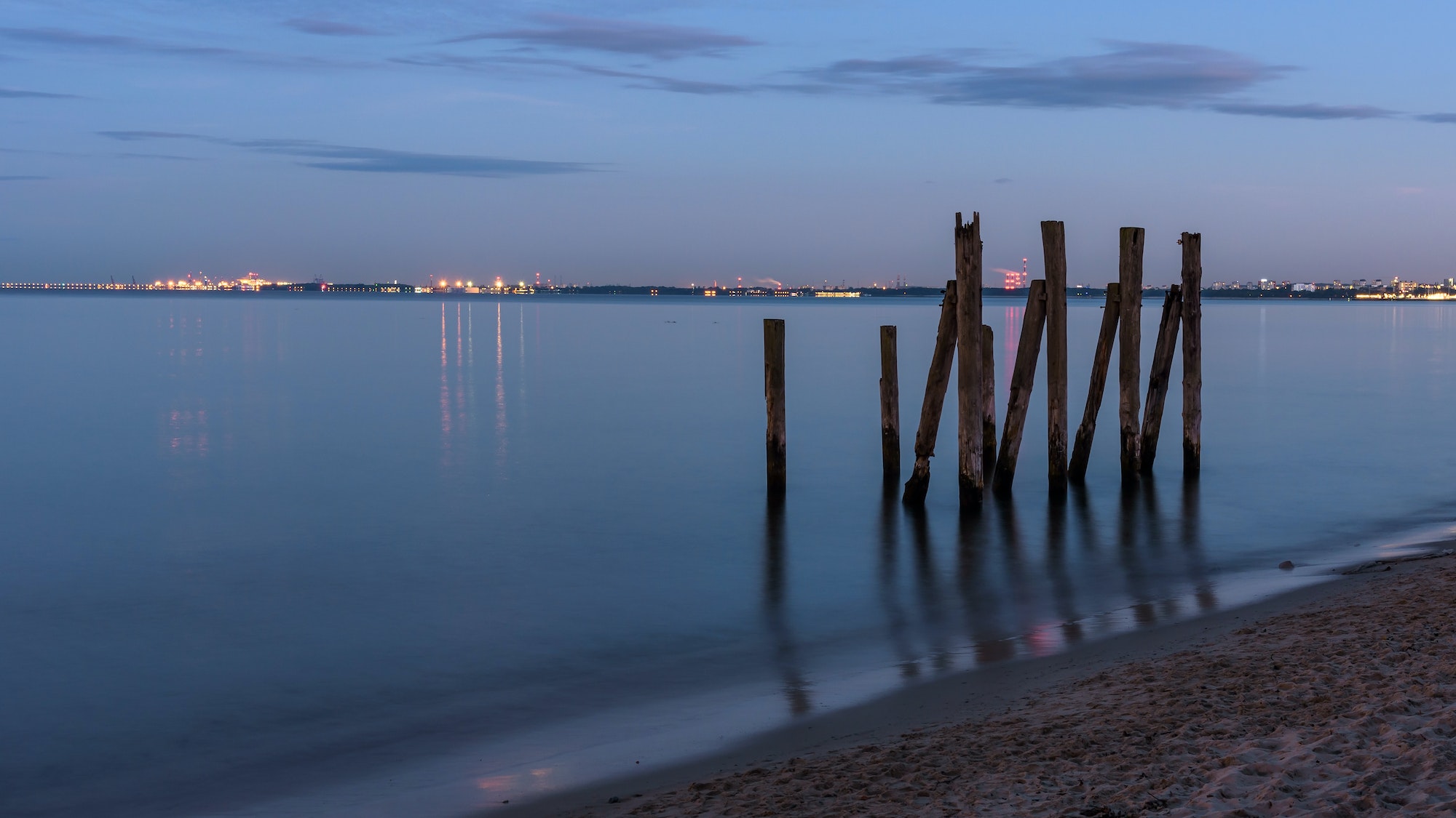 Wooden piles in the Gulf of Gdansk in Poland at dusk
